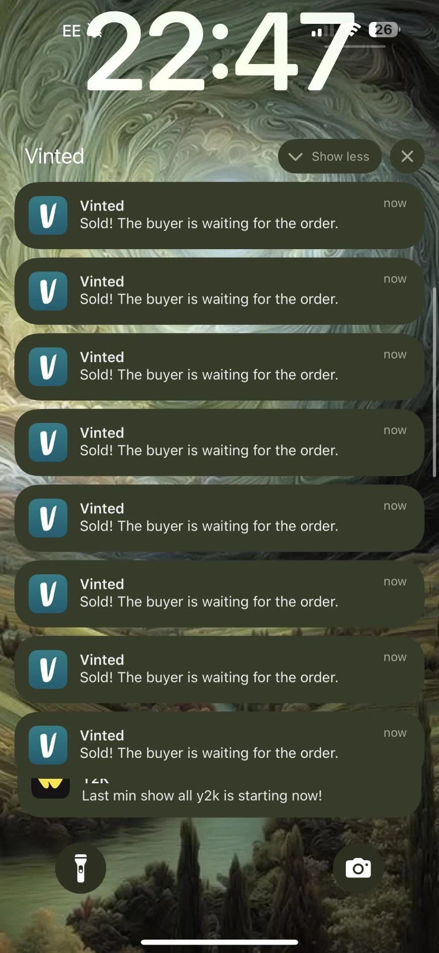 Phone showing a stream of Vinted sold notifications